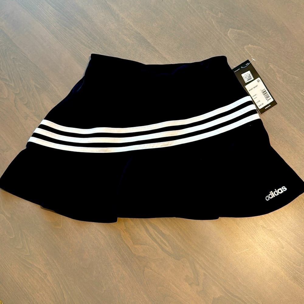 Adidas girls sport skort size large (14).  With biker shorts underneath.